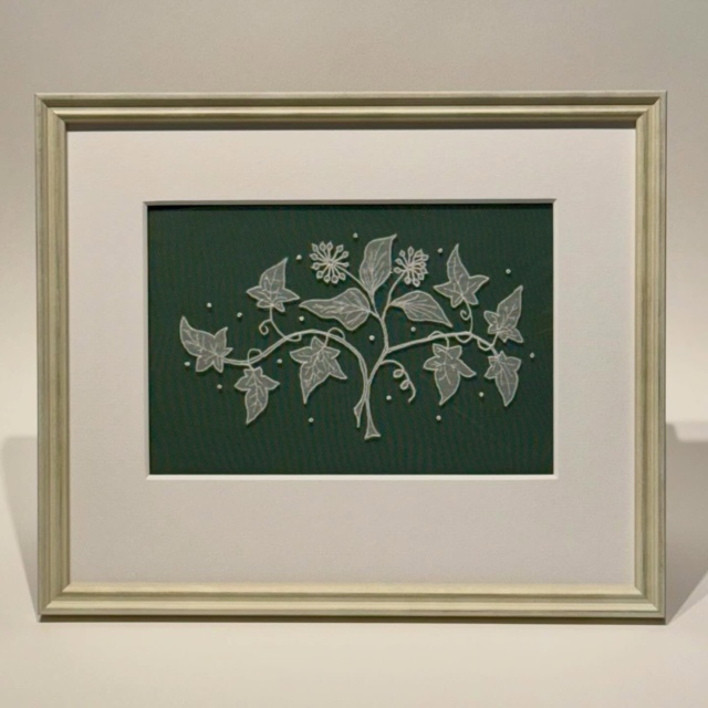 A delicate piece of lace work, floating off the green, appropriate for this time of year.